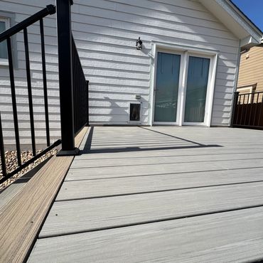 Deckorators deck with steel railings outdoor living in Parker Colorado. Best Composite deck Builder
