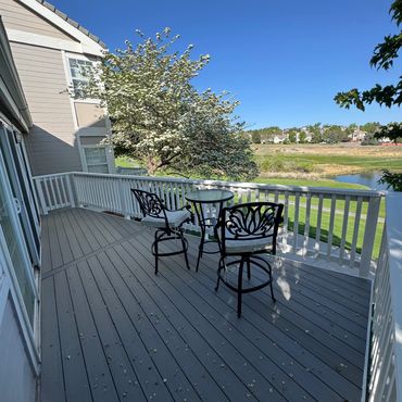 Composite deck with cedar railings in Lone Tree, Co installed by Global Cooperation LLC