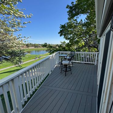 Composite deck with cedar railings in Lone Tree, Co installed by Global Cooperation LLC