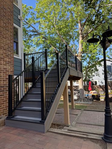 Composite stairs with steel railing build by global cooperation llc in highlands ranch, co