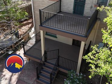 Composite two level deck with steel railings in Aurora, Co build by Global Cooperation LLC. Best Dec
