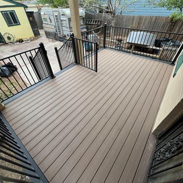 Composite deck with steel railings in Aurora, Co build by Global Cooperation LLC. Best Deck Builder 