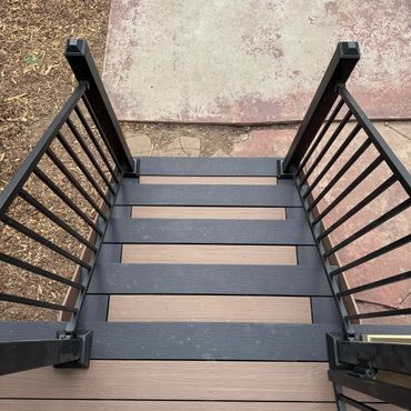 Composite deck stairs with steel railings in Aurora, Co build by Global Cooperation LLC. Best Deck B