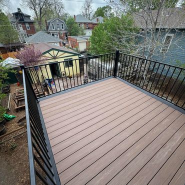 Composite second story deck with steel railings in Aurora, Co build by Global Cooperation LLC. Best 