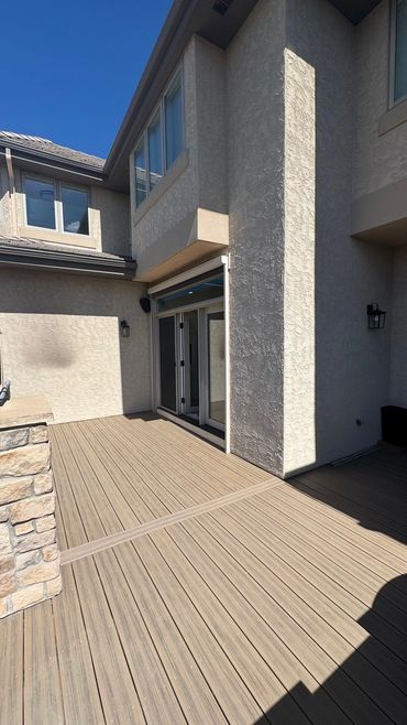 backyard custom deck with deckorators decking in highlands ranch, co build by global cooperation llc