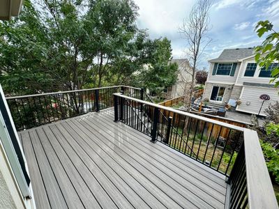 Custom composite deck built in Castle Rock, Colorado by Global Cooperation LLC with mountain views