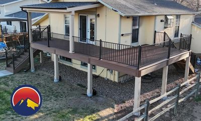 Custom composite deck with covered patio built in Englewood, Colorado by Global Cooperation LLC