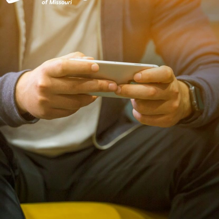 Person using phone for private, flexible telehealth therapy with Safe Harbor Counseling in Missouri.