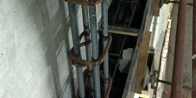 Close-up of steel reinforcement bars tied together in a concrete construction.