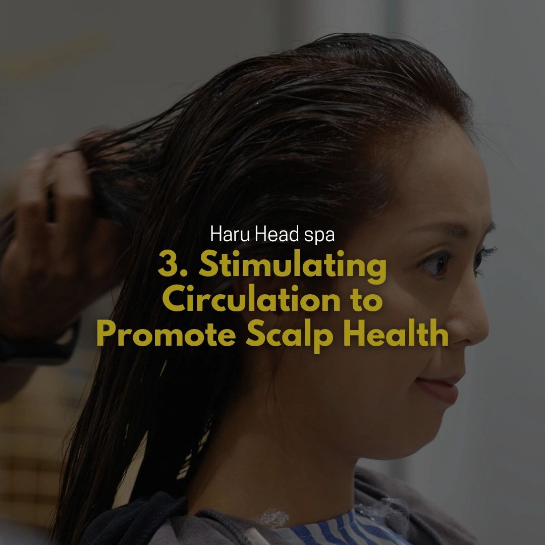 A woman receiving a hair treatment at Haru Head Spa, with a focus on stimulating circulation to promote scalp health.