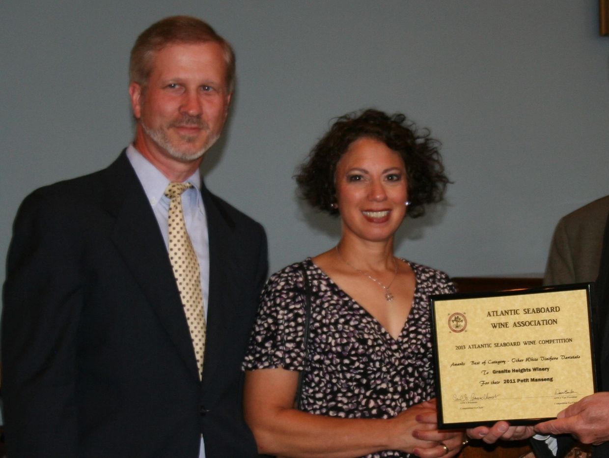 Toni and Luke receiving a wine award for one of their wines.