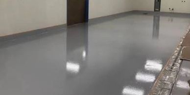 Shiny, smooth epoxy floor in a clean, empty room.