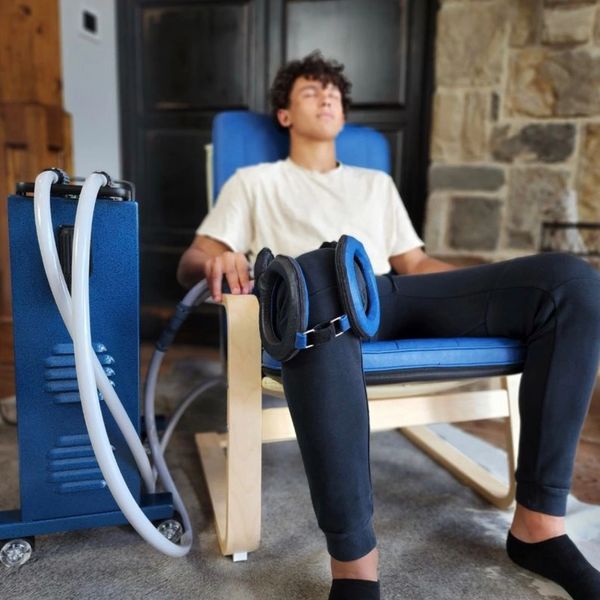 Man sitting and enjoying a PEMF Pulsed Healing session.