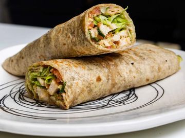 Oat Tortilla filled with mashed avocado, Pico de Gallo, iceberg, coriander and grilled chicken