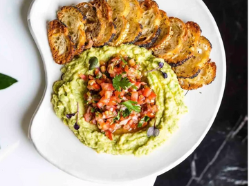 Mashed Avocado, topped with Pico De Gallo, served with our special Scrolle Sourdough chips