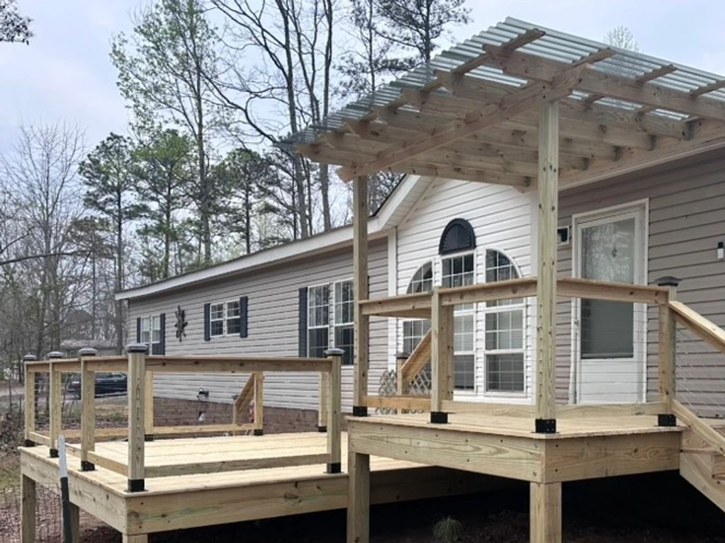 New pressure-treated deck with cable railing in Odenville,Alabama.