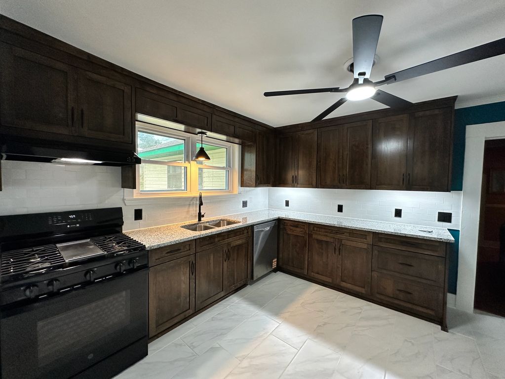 new kitchen and  cabinets jacobean color stain with white backsplash in Birmingham AL