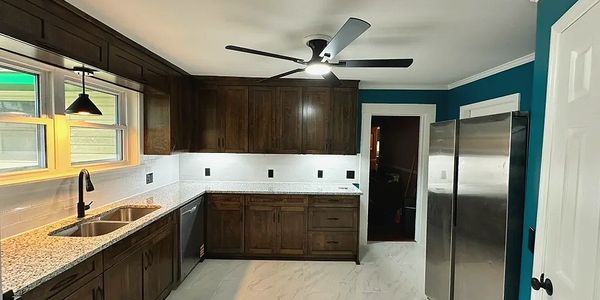 New kitchen remodel in Hoover Alabama with jacobean color  cabinets and white subway tile backsplash