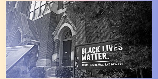 Black Lives Matter sign displayed outside a brick building.