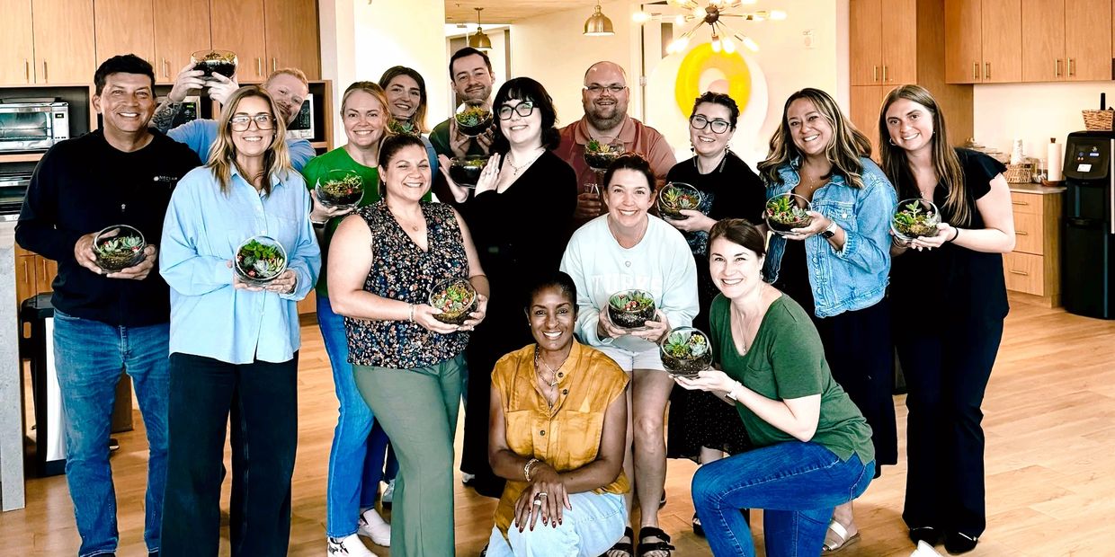 Aura Plan Studio owner hosts a group terrarium class as a working group activity for a local Adverti