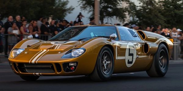 Our Gold Ford GT40 Mk2 cruising down Las Vegas Blvd from The Sema Show. 