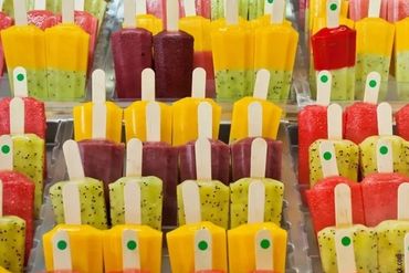 Colorful popsicles arranged in rows.