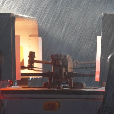 Metalworking machine in operation with sparks or smoke effect.
