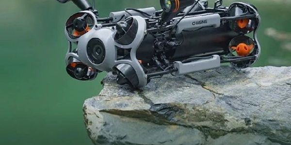 Underwater drone resting on a rock.