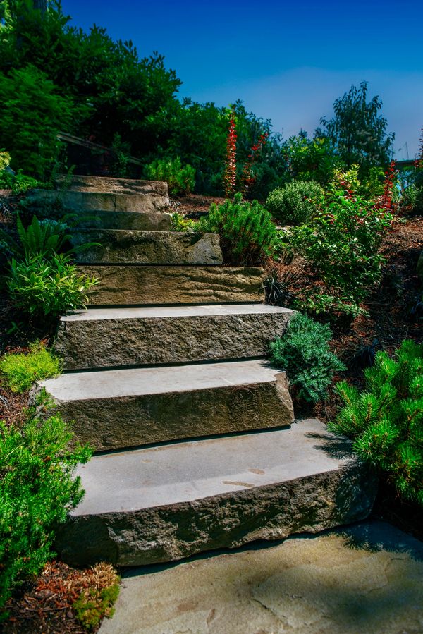 Basalt stone stair treads leading to pennsylvania bluestone patio, planting, walkways, outdoor stair