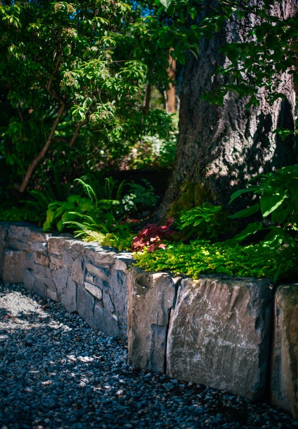 Basalt stone retaining wall, planting details, stone wall, side yard