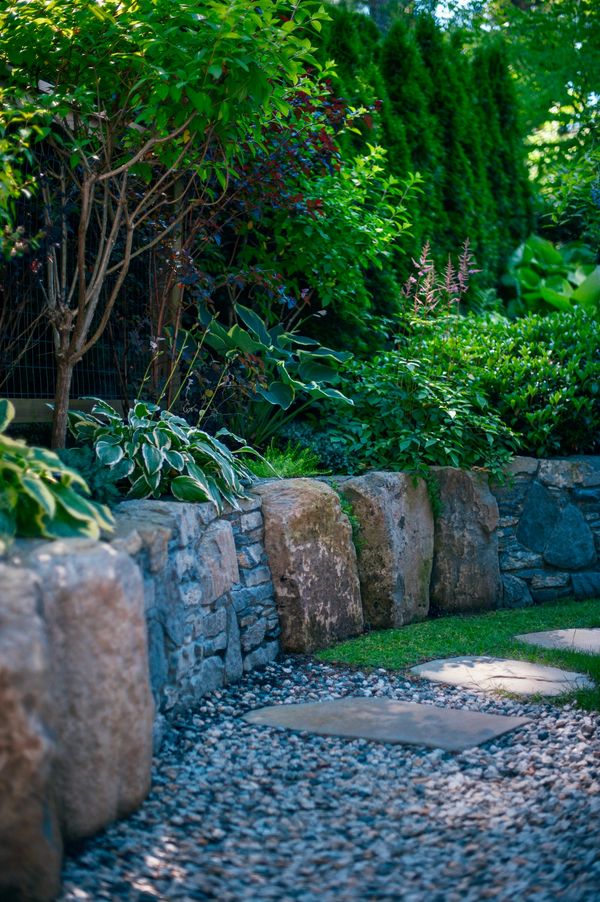 Basalt boulders/mortared basalt stone retaining wall, planting details, side yard, lawn area