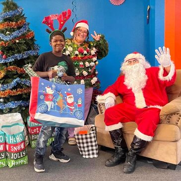 Kids receiving gifts from Santa