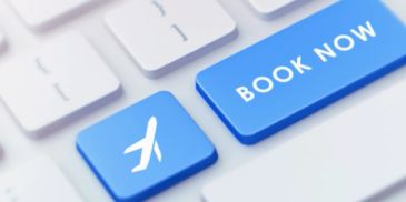 Keyboard keys with airplane icon and 'BOOK NOW' button.