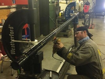Owner / Operator Brett Olson rebuilding a downhole motor 