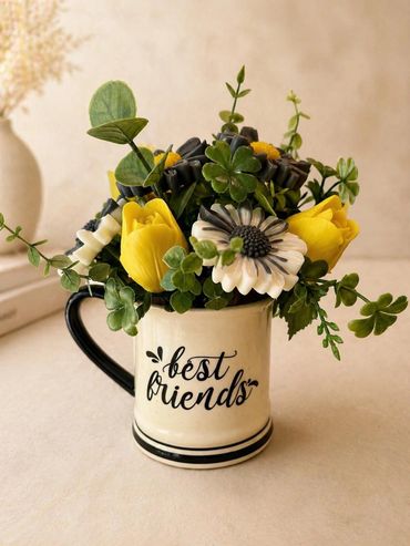 Mug with flowers and 'best friends' text.