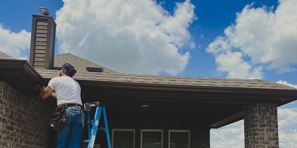Owner Andrew completing a gutter installation