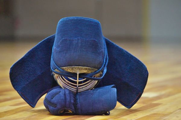 Kendo armor set on a wooden floor.