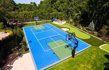 Cincinnati full court basketball court installed with putting green and batting cages