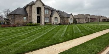 Striped lawn mowing in Nicholasville KY with clean edges by BBN Lawn Care weekly service