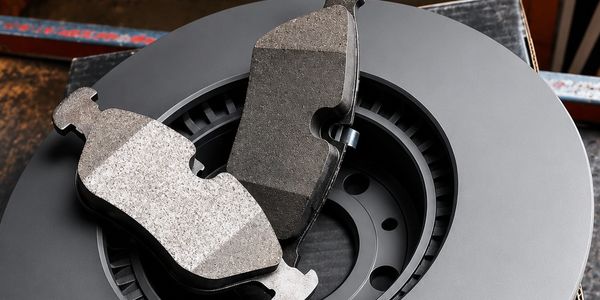 Close-up of brake pads and disc rotor.