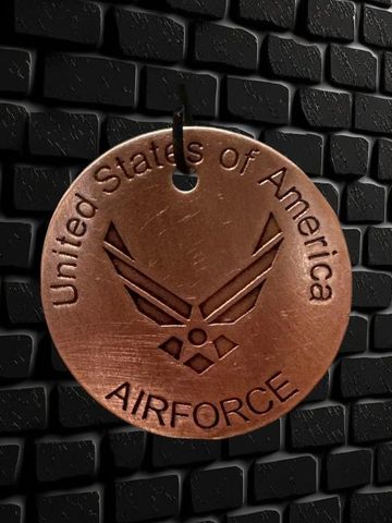 Copper Air Force tag with United States of America text.