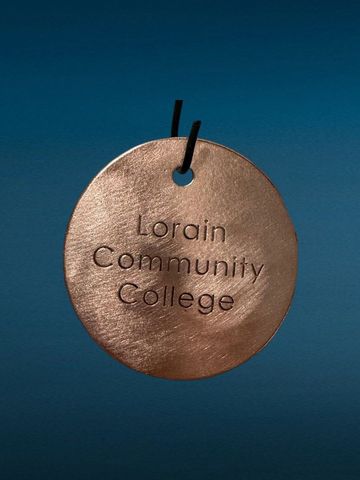 Medal with 'Lorain Community College' inscription.