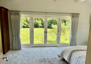 Double Pinch Pleat Curtain at full length bedroom window