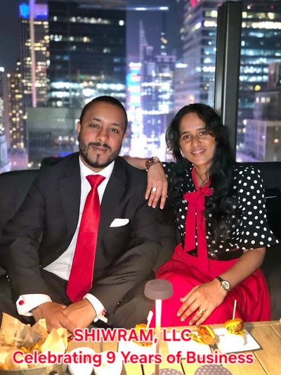 A man and woman celebrating 9 years of business at SHIWRAM, LLC.