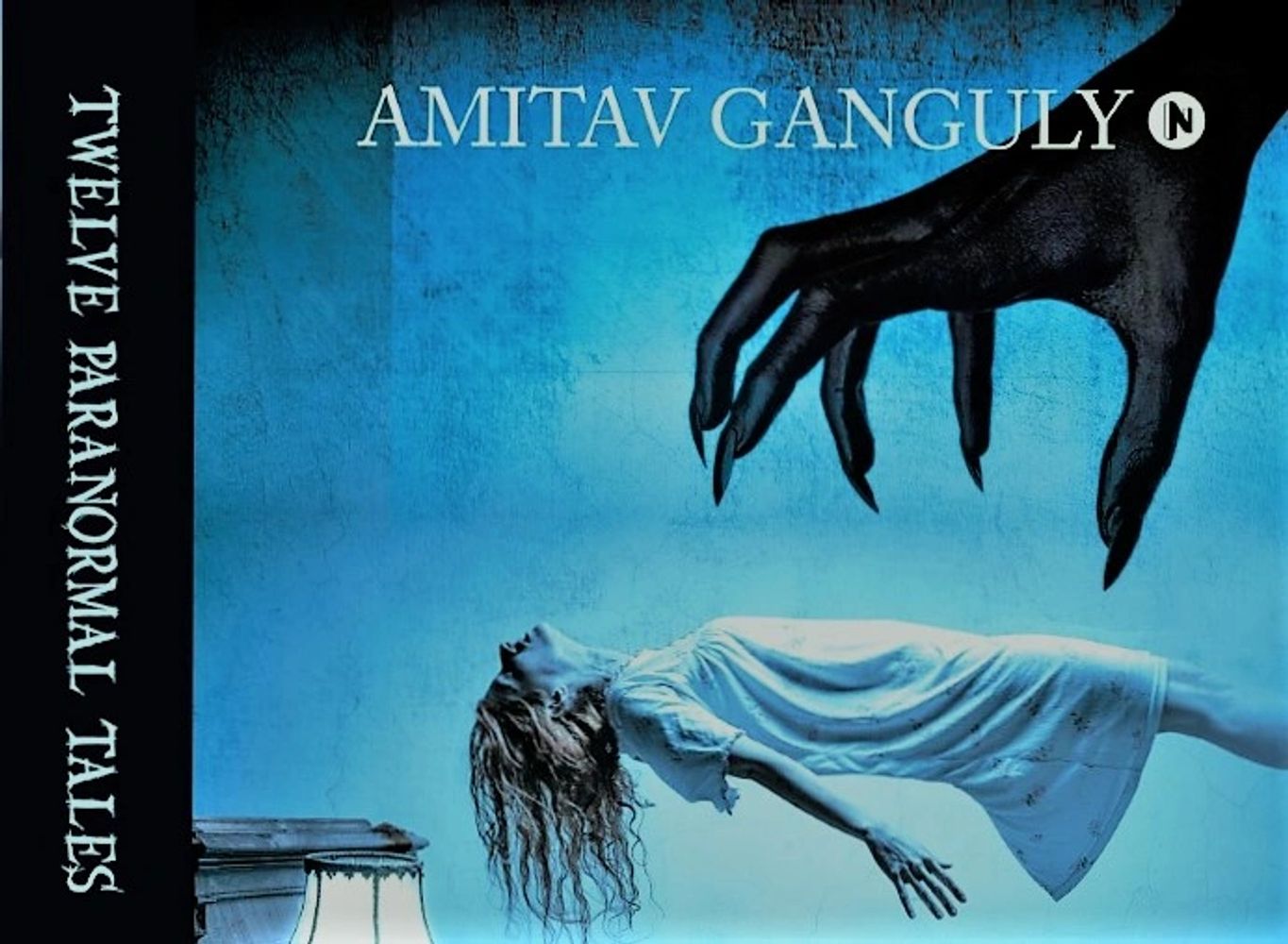 Horror book cover showing a woman levitating with a dark clawed hand above her.