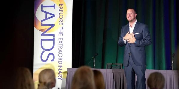 Chase DeMayo speaking at the IANDS conference