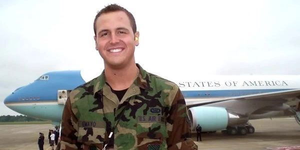 Chase Skylar DeMayo in U.S. Air Force uniform by a presidential aircraft