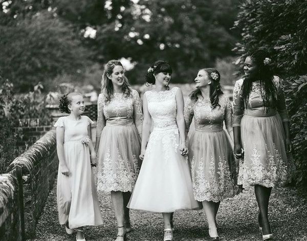 Bride with her bridesmaids having their picture taken at Ufton Court, Berkshire