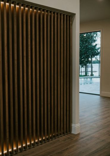custom solid maple slat wall with recessed integral LED lighting 