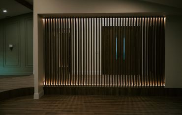 custom slat wall made of solid maple with recessed integral LED lighting 